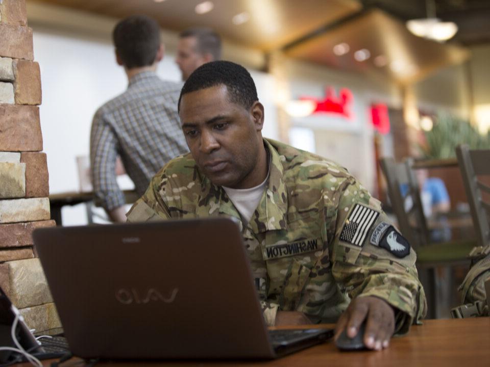 military student on laptop